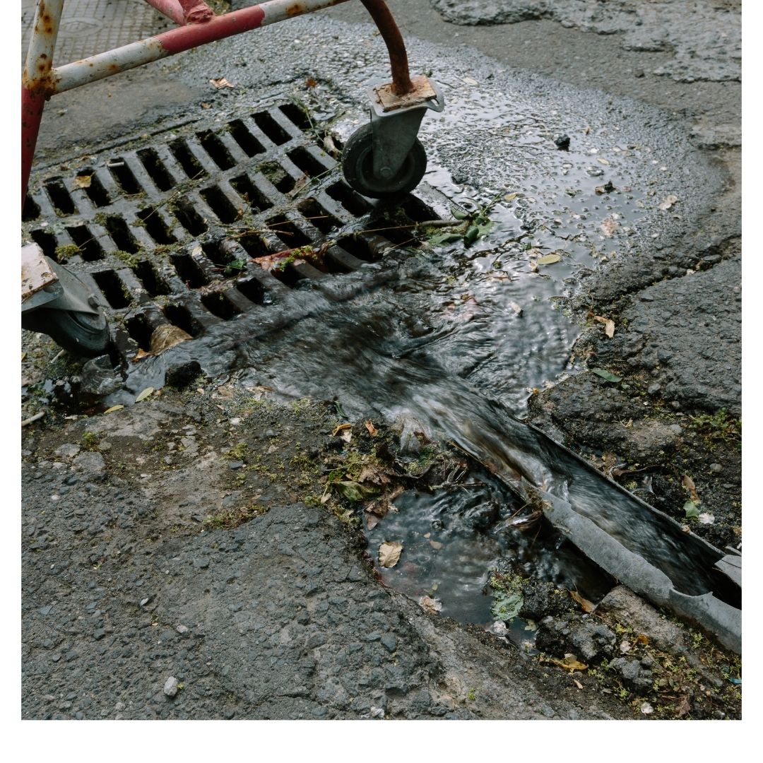 water going into sewer grate